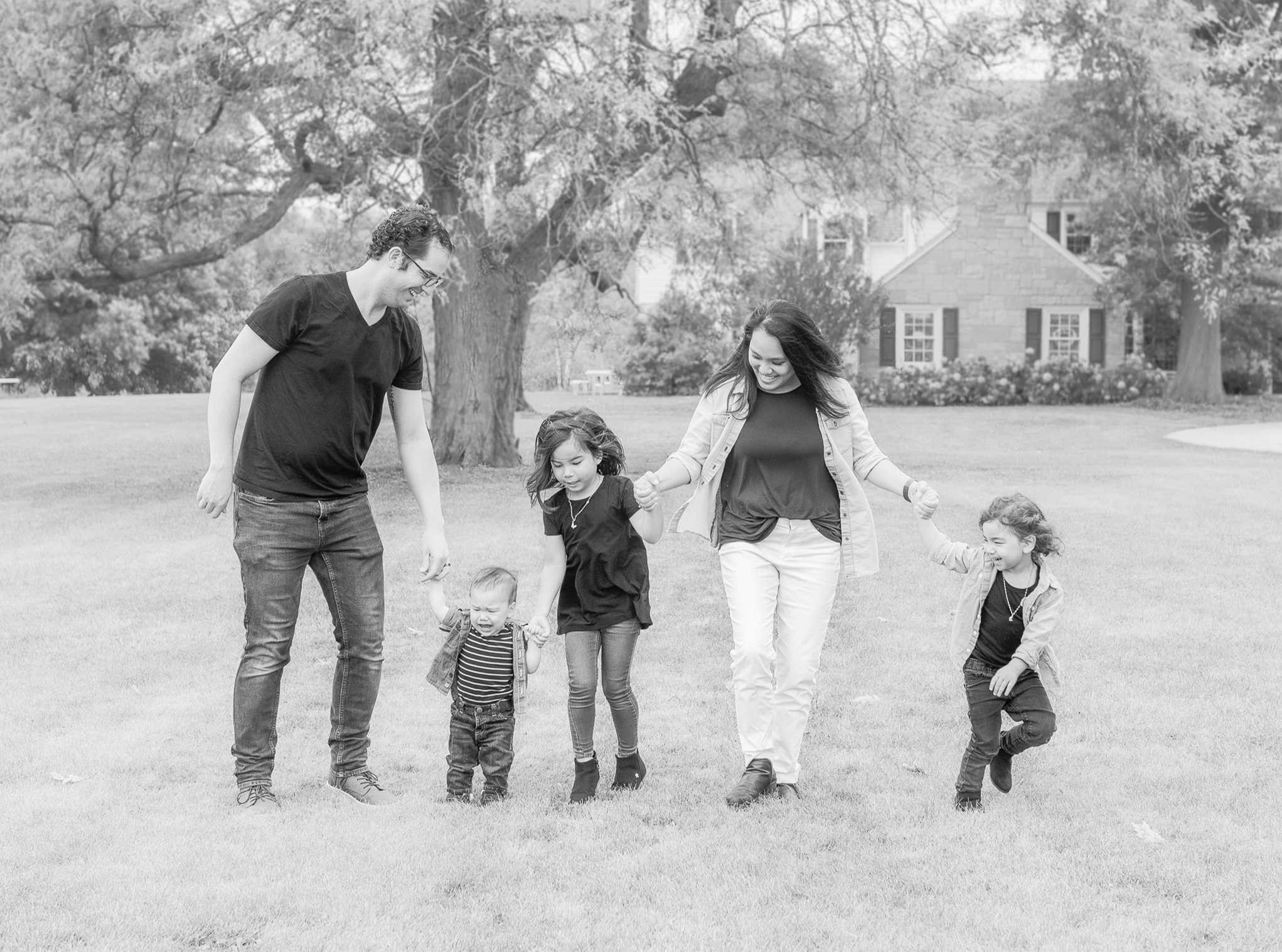 Fall Family Session, St. Charles, IL. LeRoy Oaks Forest Preserve. Family is standing in a line, holding hands, dancing