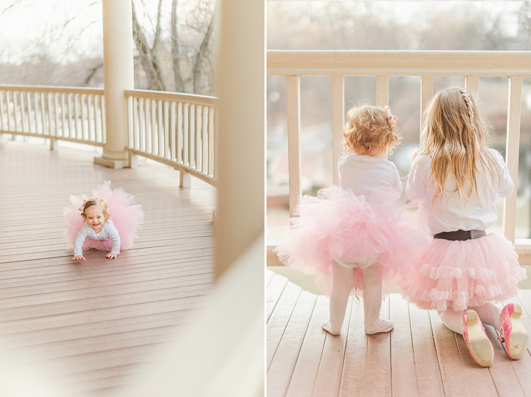 First birthday session with her bigger sister. Both are wearing matching outfits