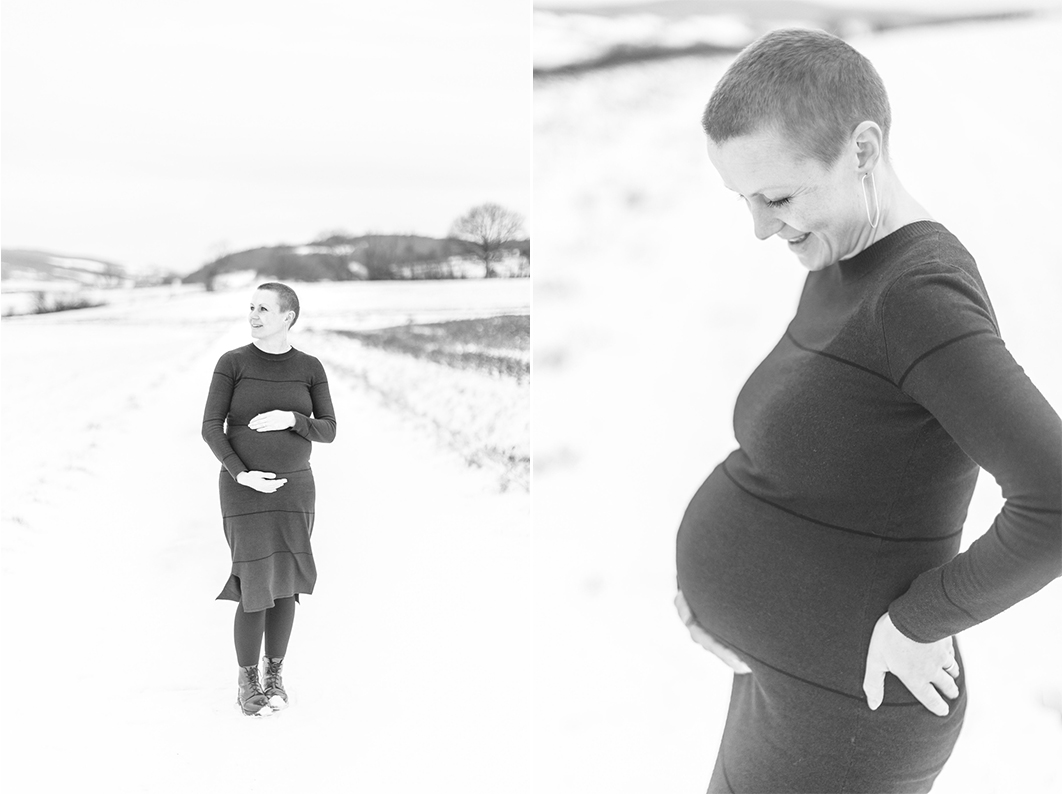 Maternity Session in the Winter with a view of snow-covered hills. Mom is walking towards the camera, looking out at the view.