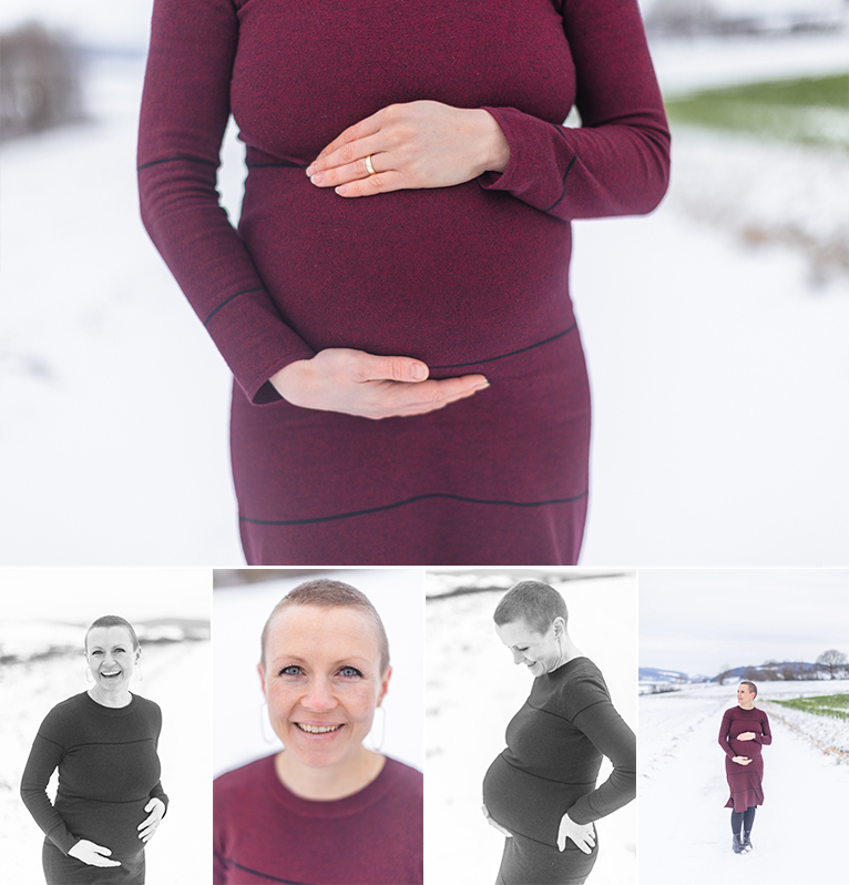 Winter maternity Destination Session in Germany. Header image. Mother is holding her belly, smiling into the camera.