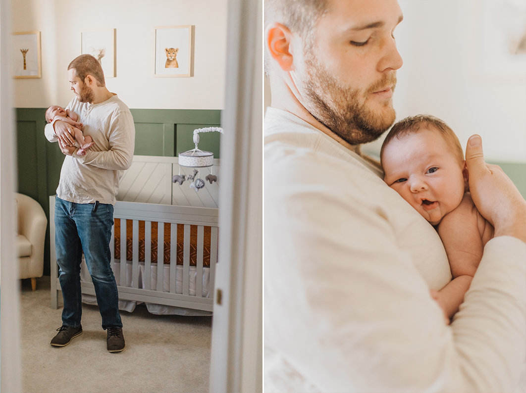 Dad is holding his newborn against his chest, while standing in the baby's new nursery during their in-home newborn lifestyle session