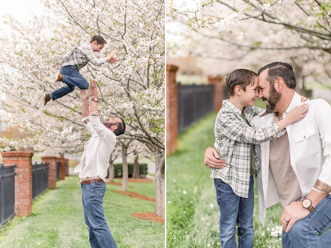 Photo of Dad kneeling in front of his son, touching foreheads and looking into each others eyes, while smiling big during charlotte spring minis with white cherry clossoms