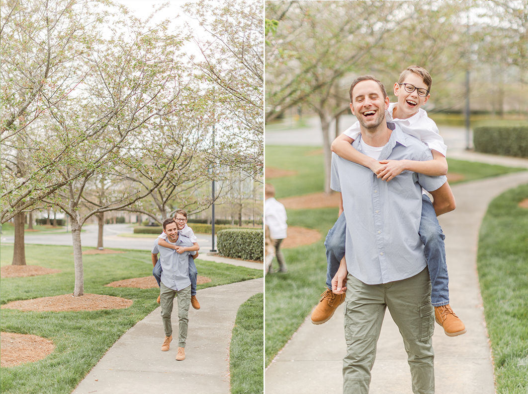 Dad is giving his 10 year old son a piggy back ride. Both are laughing into the camera during a spring family session in Charlotte NC